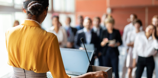 Leadership speaker at a podium