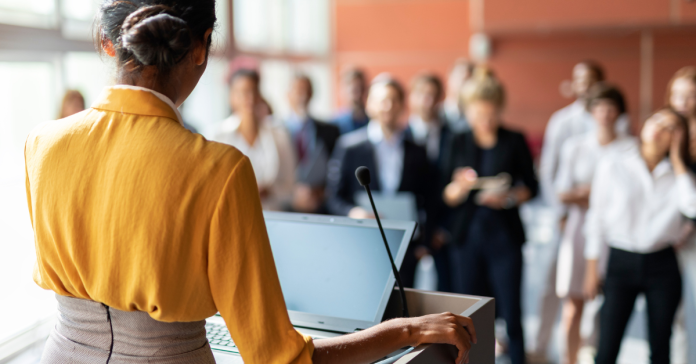 Leadership speaker at a podium