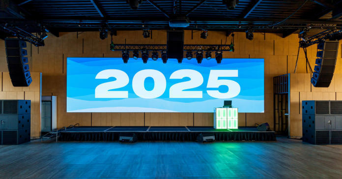 Event stage with "2025" up on the screen