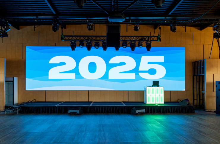 Event stage with "2025" up on the screen